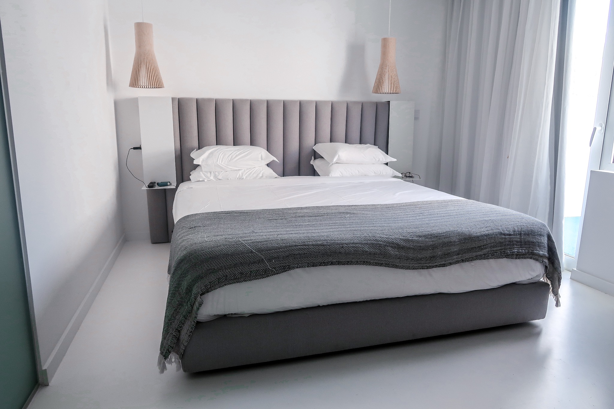Large bed in room - Hotel California in Albuferia Old Town, The Algarve Portugal | eco-friendly, vegan, adults-only hotel with a modern twist | On The Beach Holidays Review | Elle Blonde Luxury Lifestyle Destination Travel Blog