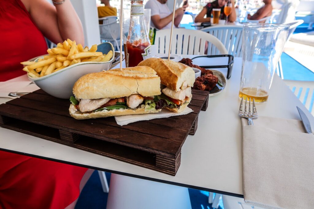 Chicken club at pool bar - Hotel California in Albuferia Old Town, The Algarve Portugal | eco-friendly, vegan, adults-only hotel with a modern twist | On The Beach Holidays Review | Elle Blonde Luxury Lifestyle Destination Travel Blog