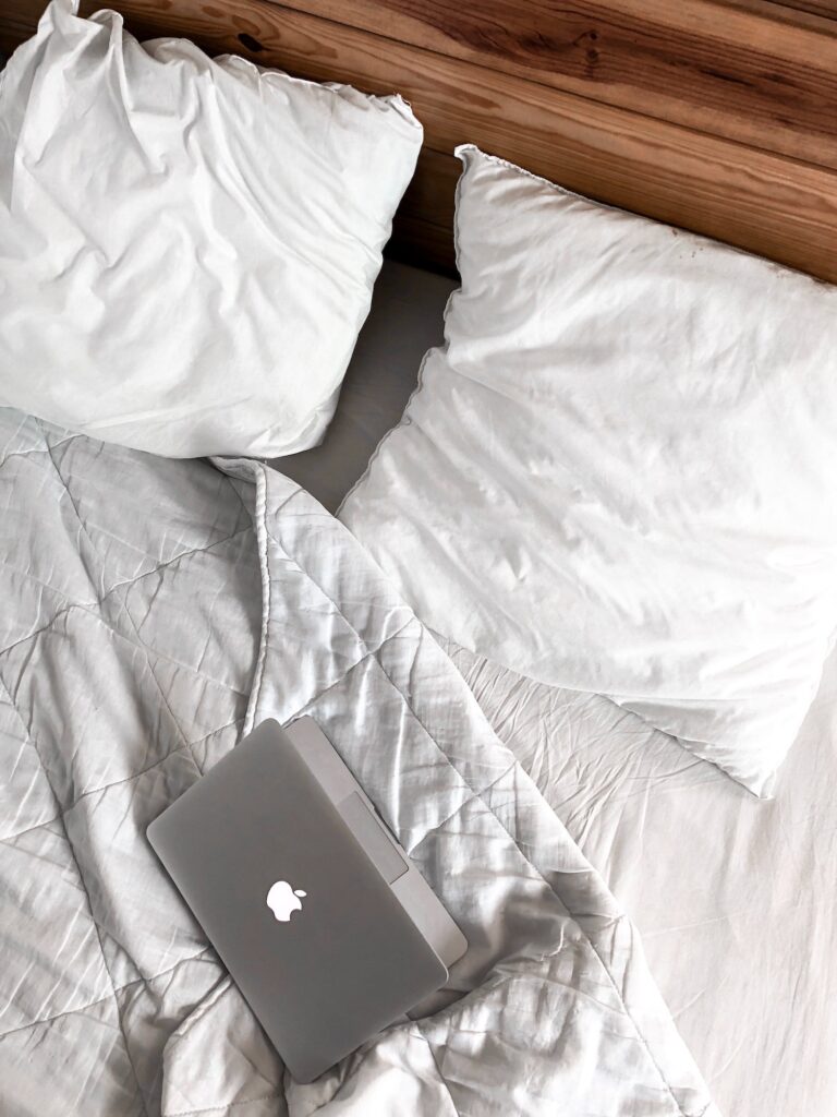 Macbook on bed | 6 Ways How You Can Get Rid Of Acid Reflux Quickly | Fast Health Tips | Elle Blonde Luxury Lifestyle Destination Blog