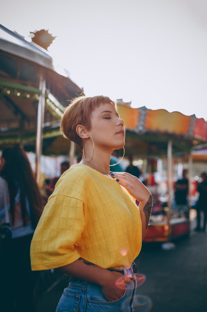 Girl In Yellow Top & Hoop Earrings At Funfair | 5 Ways To Wear Earrings To Help Them Be More Flattering | Fashion & Style | Elle Blonde Luxury Lifestyle Destination Blog