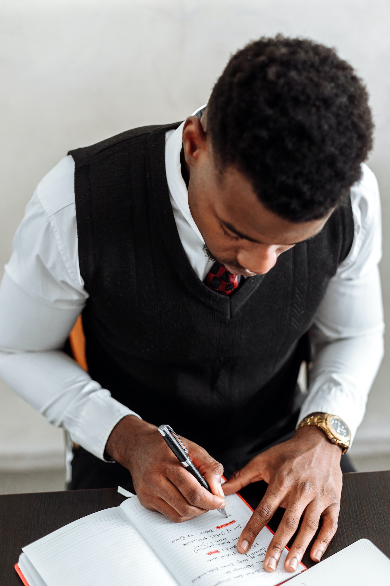 Man writing in book | What Do You Need To Be An HR Consultant? | Business & Education | Elle Blonde Luxury Lifestyle Destination Blog | Entrepreneurs | Exploring the Safety of Online TRT: A Comprehensive Guide for Understanding the Risks and Benefits