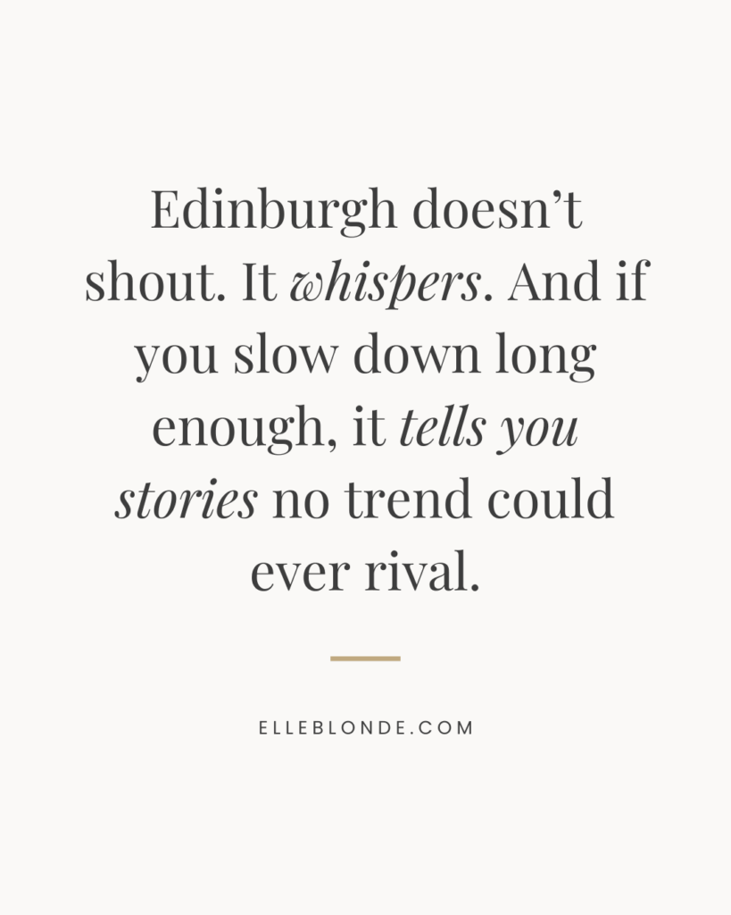 Minimalist beige graphic with black serif typography reading: “Edinburgh doesn’t shout. It whispers. And if you slow down long enough, it tells you stories no trend could ever rival.” — ElleBlonde.com.