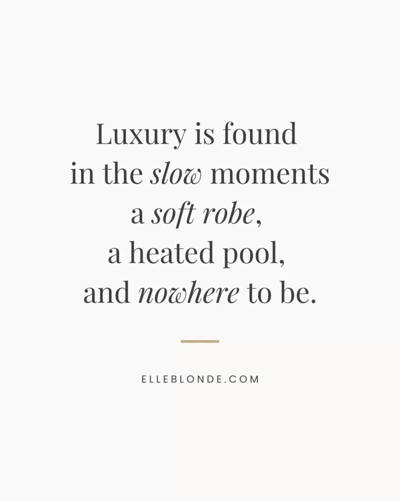 The Ultimate Villas In Sicily With Heated Pools 5 Quote graphic reading “Luxury is found in the slow moments — a soft robe, a heated pool, and nowhere to be.” Elegant soft girl luxury travel aesthetic for Sicily villas blog post. Elle Blonde. | Travel Tips | Elle Blonde Luxury Lifestyle Destination Blog