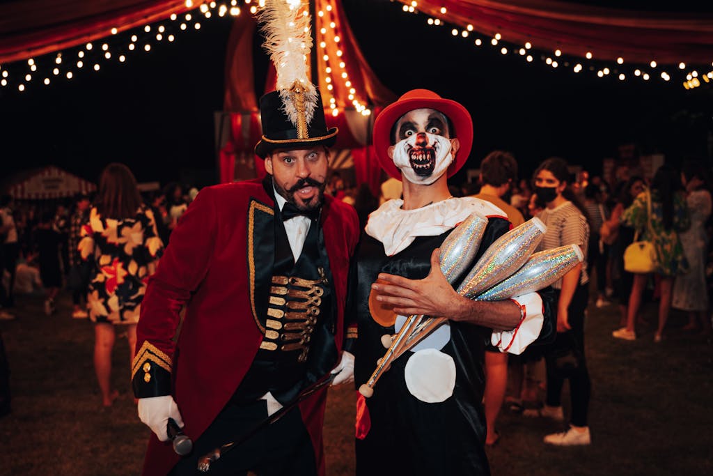 Step Right Up…It’s a Carn-Evil Halloween 3 A lively night circus-themed party with performers in vibrant costumes, capturing the essence of celebration.