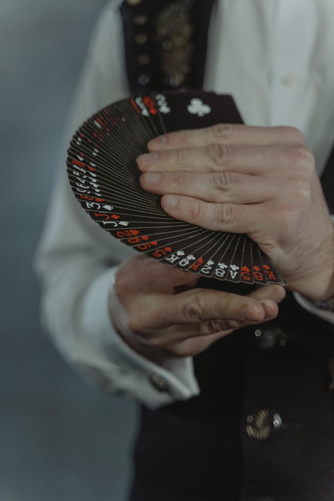 How Live Casinos Are Making Gaming More Accessible for Women 3 How Live Casinos are Making Gaming More Accessible for Women An illusionist elegantly displaying a fan of black playing cards during a magic performance.