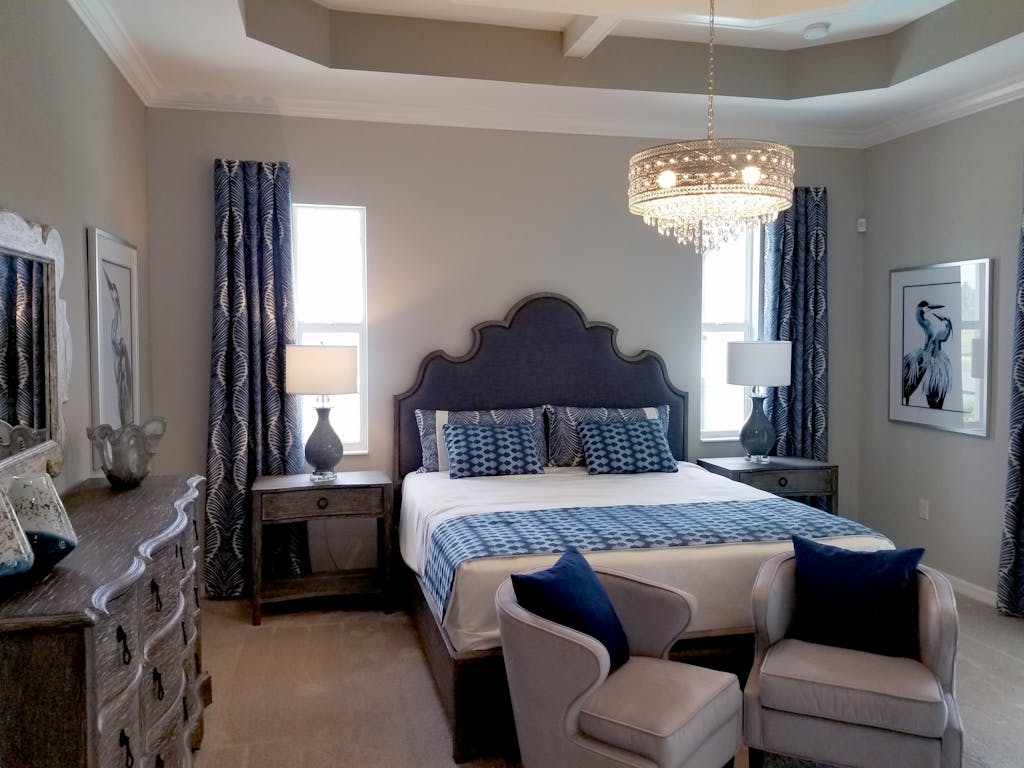 Creating Your Sanctuary: How Choice of Color Can Transform Your Home into a Wellness Hub 3 Elegant bedroom with plush furniture and ornate chandelier, ideal for home decor inspiration.