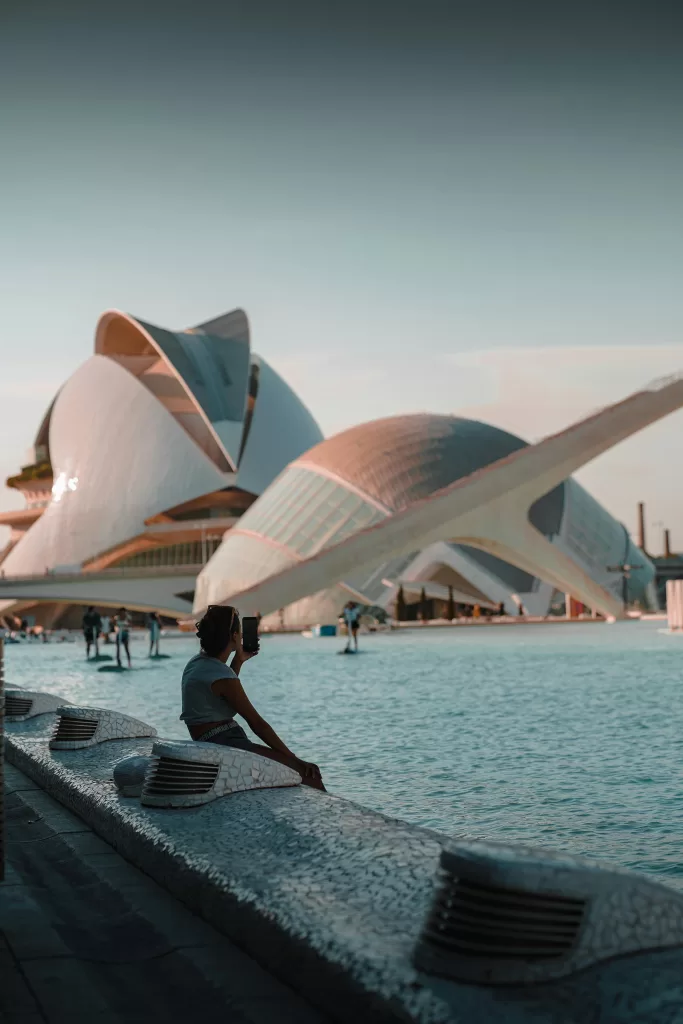 Discover Valencia: A Mediterranean Gem of Culture, Sunshine and Unique Experiences 5 Woman taking a selfie at the City of Arts and Sciences in Valencia, Spain – futuristic architecture meets Mediterranean sunshine in this must-visit cultural landmark. | Travel Tips | elle blonde Luxury Lifestyle Destination Blog