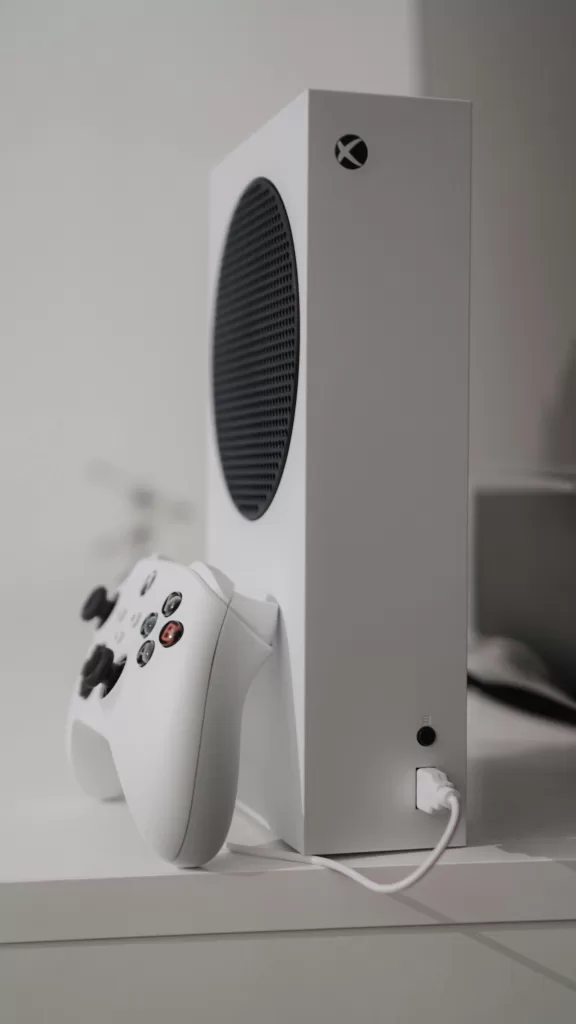 Skill Based Gaming: A Career of the Future? 4 Minimalist shot of a white Xbox Series S and matching controller on a sleek desk—perfect for design-conscious gamers. | Travel Tips | Elle Blonde Luxury Lifestyle Destination Blog