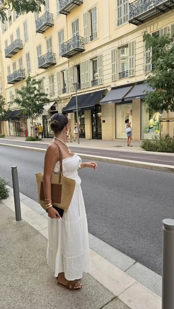 Visiting Lyon With Children: How To Plan A Child Friendly Holiday 5 Elegant woman in a white tiered strapless dress and straw tote, shopping in the South of France – Cote d’Azur luxury style.